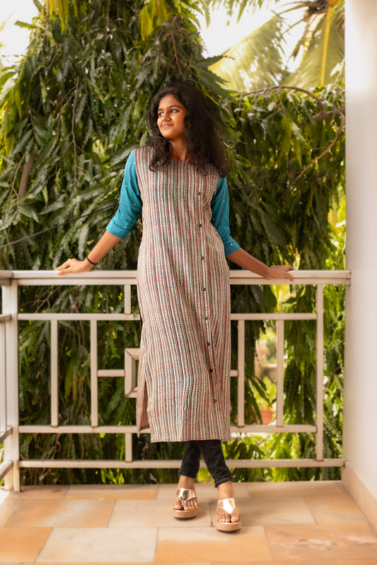 A Rayon A-Line designer kurti with contrast sleeves and mirror work. Handcrafted in Chennai