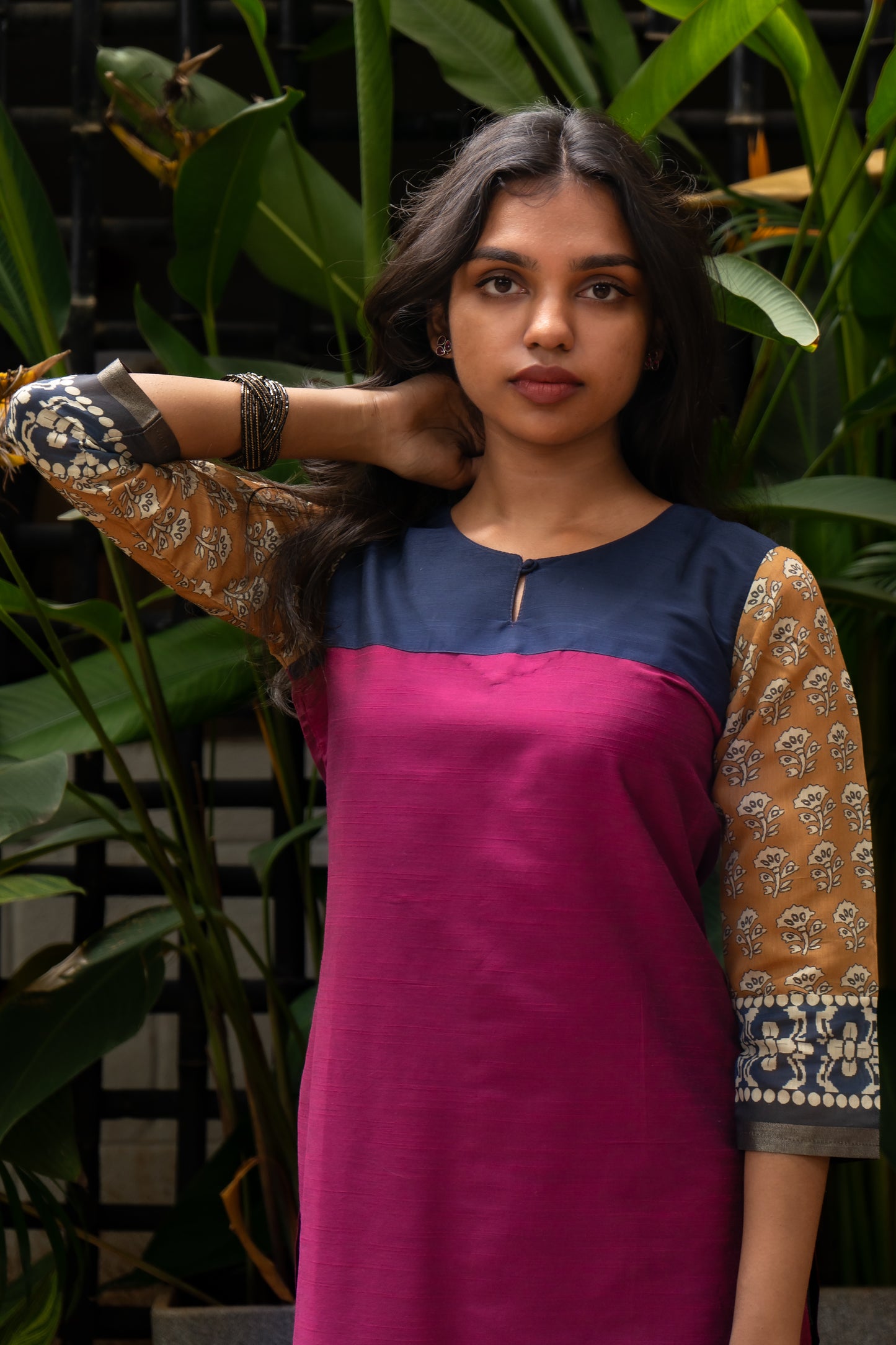 Elevate your ethnic wardrobe with this vibrant magenta cotton silk kurti. The contrast yoke adds a pop of color, while the printed chandheri sleeves bring a touch of elegance. The soft and luxurious fabric ensures comfort and style. Perfect for both casual and formal occasions, this versatile kurti can be paired with leggings, jeans, or palazzos.