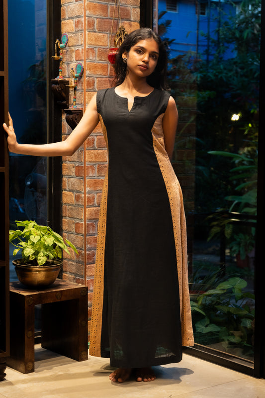 Front view of black linen ankle-length A-line dress with light beige Hakoba side panels and sleeveless split neck design from Sakyaa.