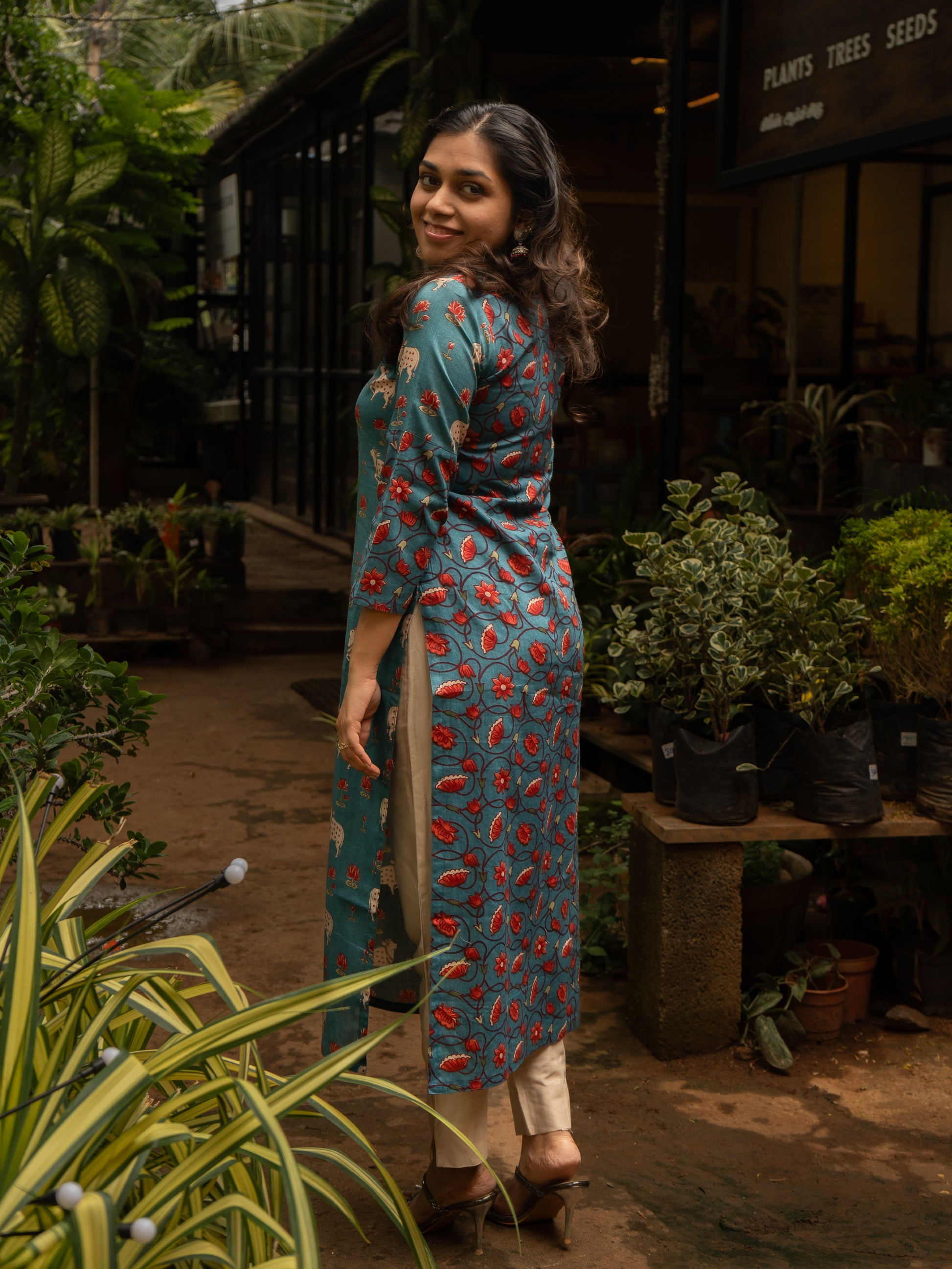 Back view of blue Pichwai cotton kurti featuring pink floral vine patterns, 3/4th sleeves, handcrafted in-house by Sakyaa tailors