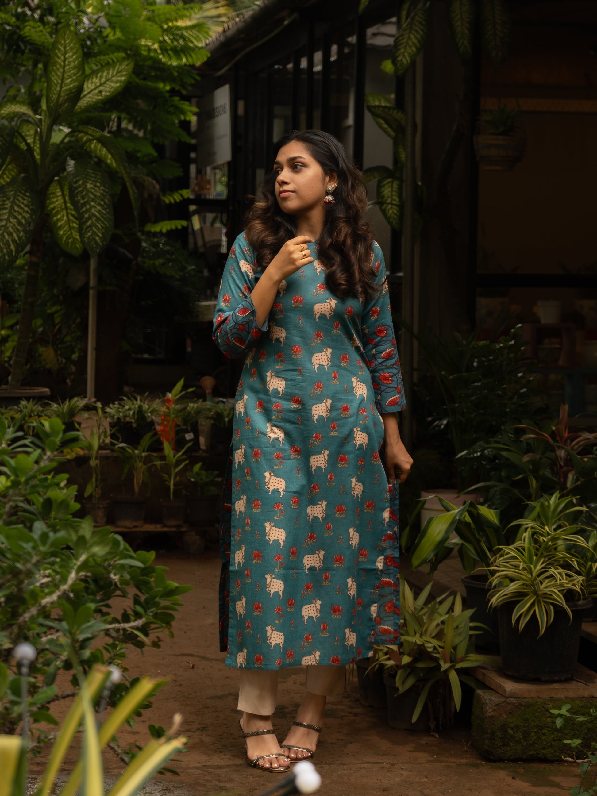Blue cotton Pichwai kurti with curved bracket neckline, cow and lotus print, 3/4th sleeves, in-house stitched, front full view.