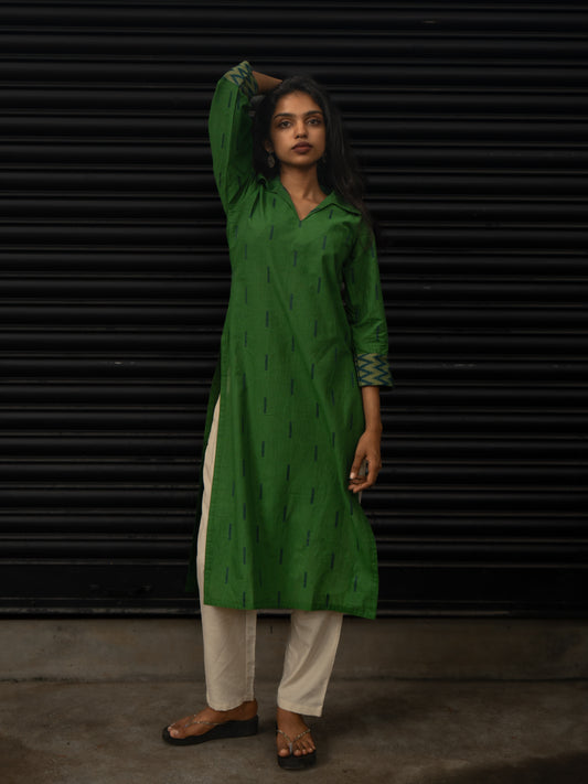 Green handloom cotton kurti with dark blue line patterns, T-shirt collar, 3/4th sleeves with woven zig-zag borders, front view, in-house stitched.
