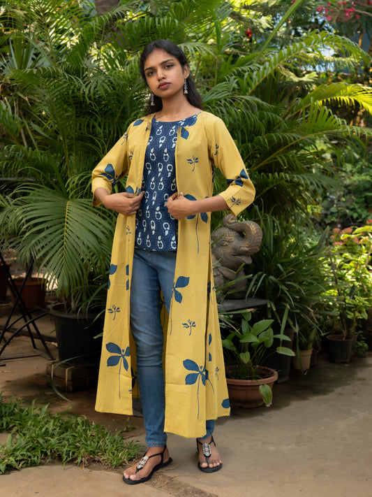 Front view of indigo sleeveless cotton top with yellow floral printed cotton cape jacket featuring A-line cut and 3/4th sleeves from Sakyaa.