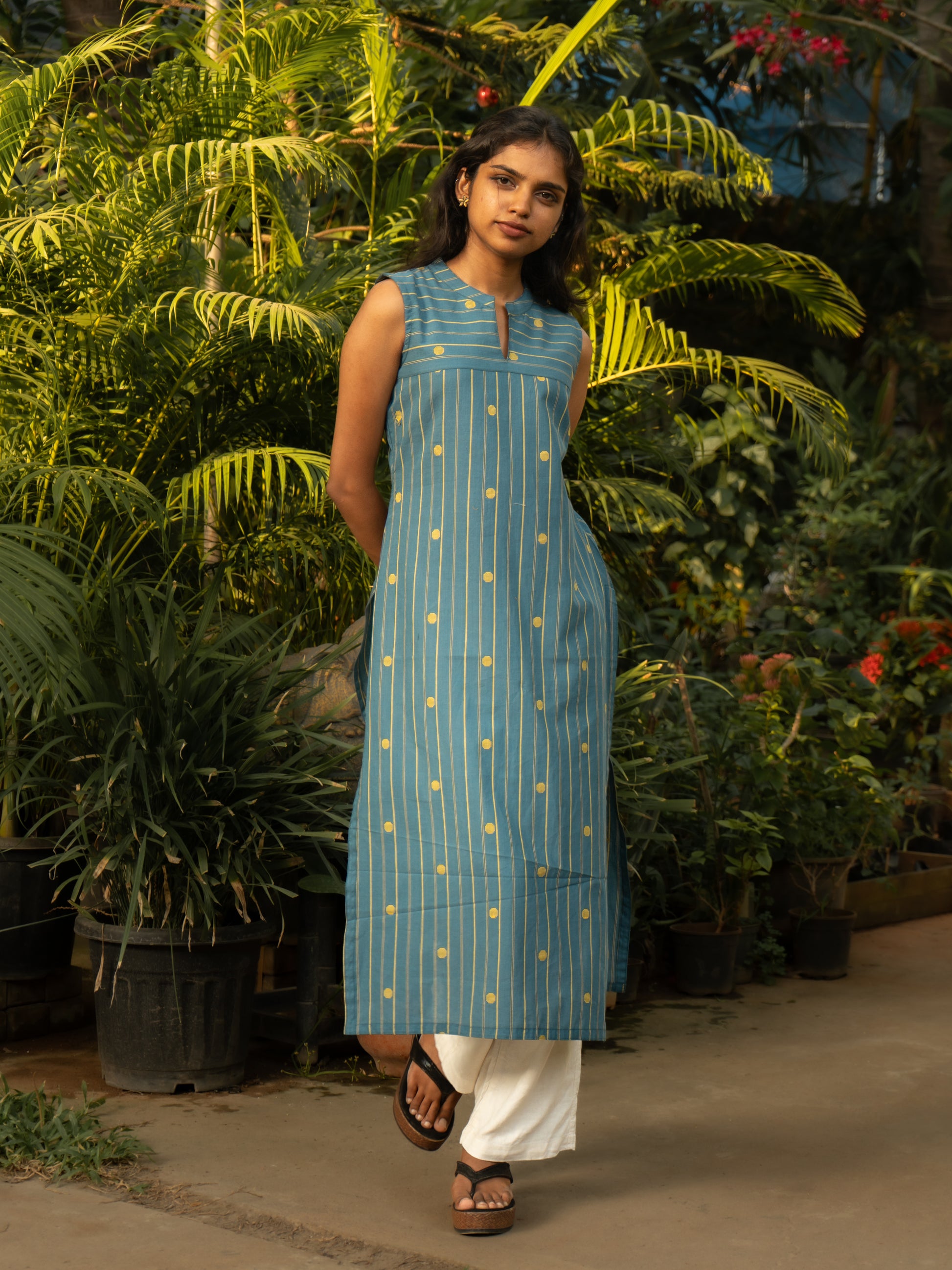 Front view of light blue cotton striped kurti with contrast yellow woven buttas, sleeveless and Chinese collar design from Sakyaa.
