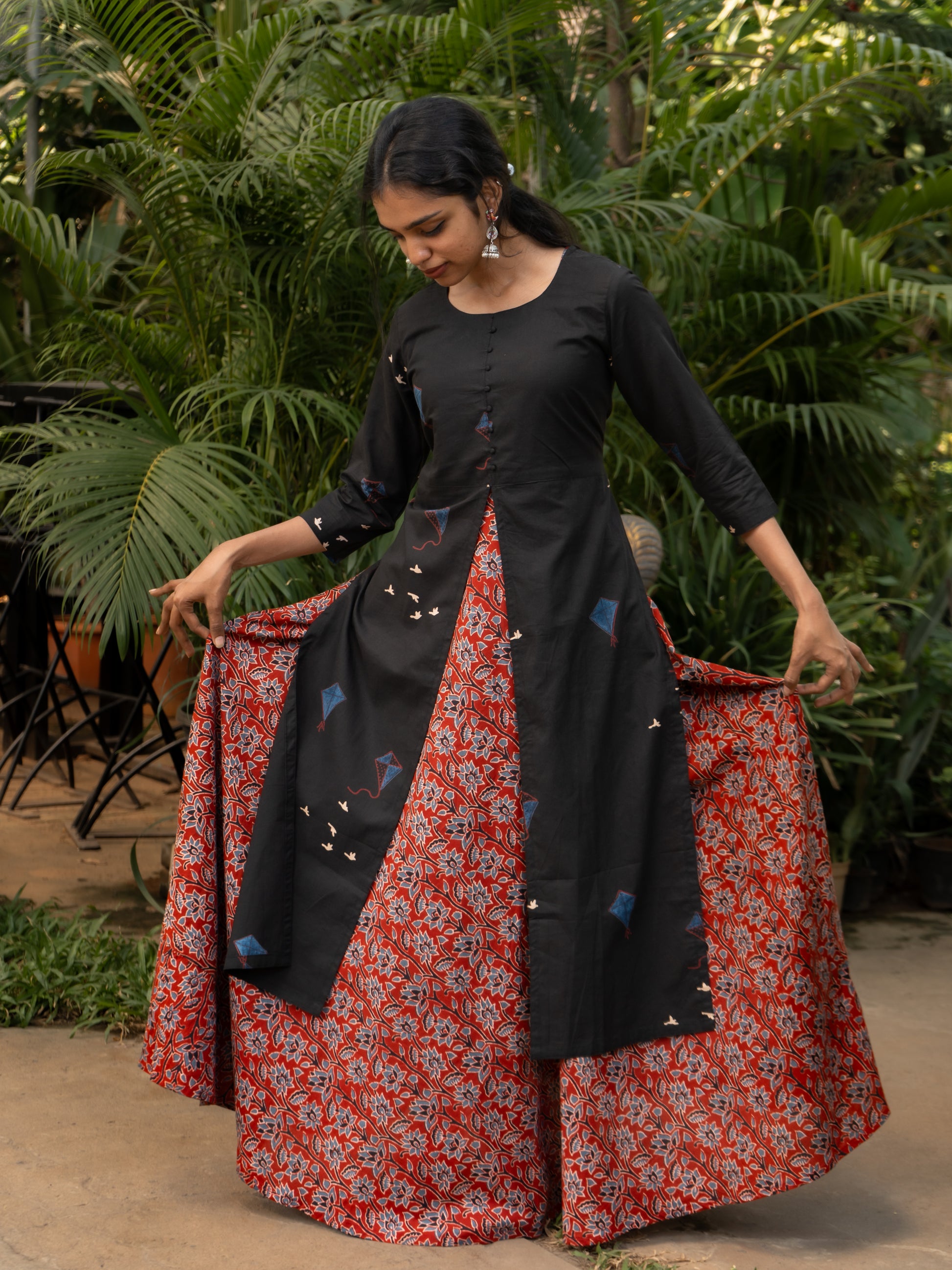 Front view of maroon floral printed bagru cotton gown paired with black kite print cotton kurti featuring high center slit and side slits from Sakyaa.
