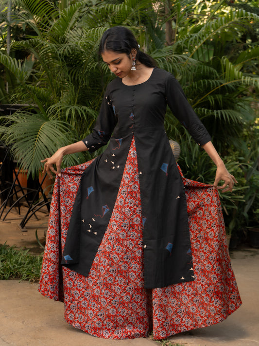 Front view of maroon floral printed bagru cotton gown paired with black kite print cotton kurti featuring high center slit and side slits from Sakyaa.