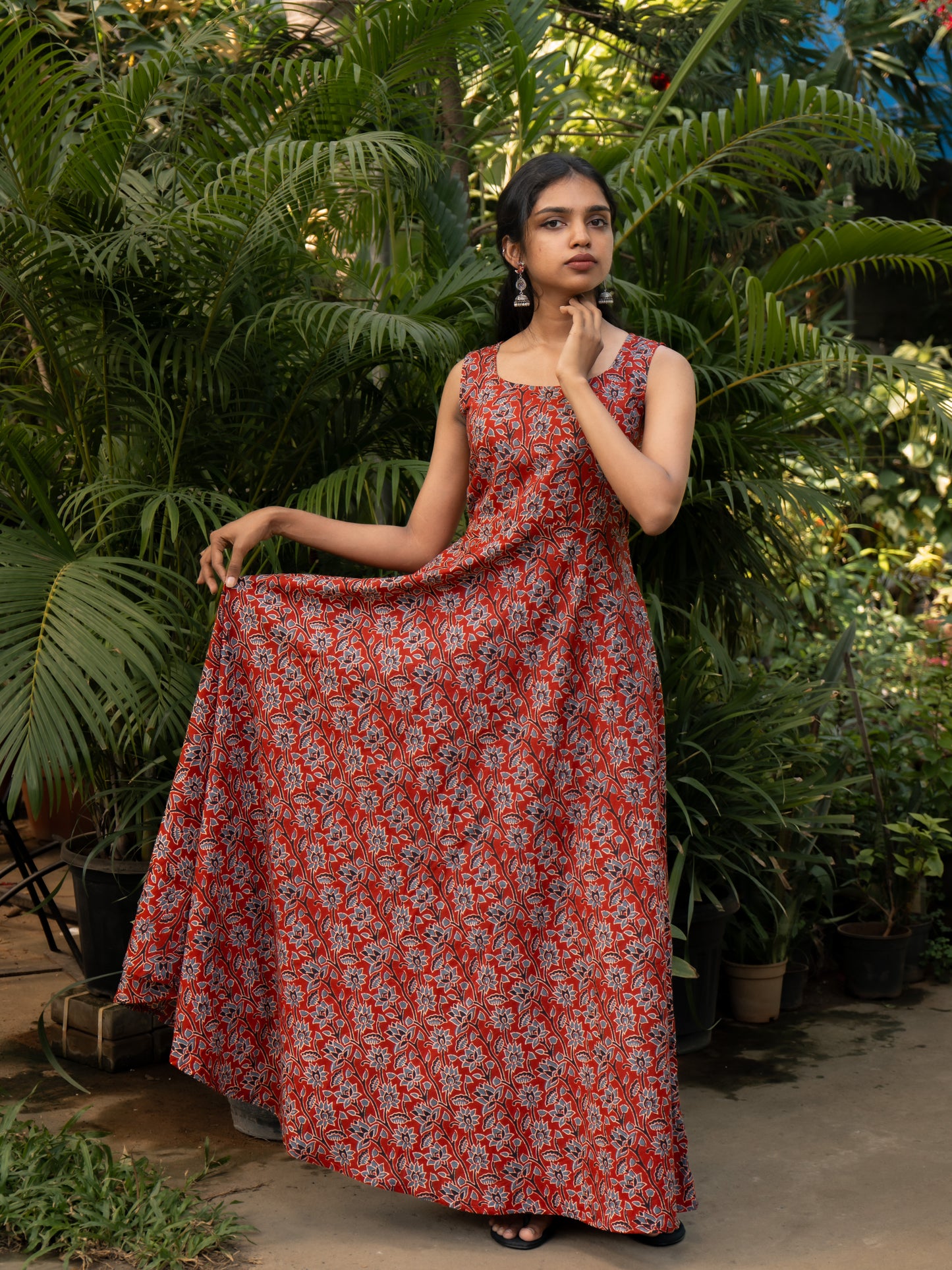 Styled layered look of maroon bagru floral cotton gown and black kite print cotton kurti with high slit from Sakyaa's ethnic fusion collection.