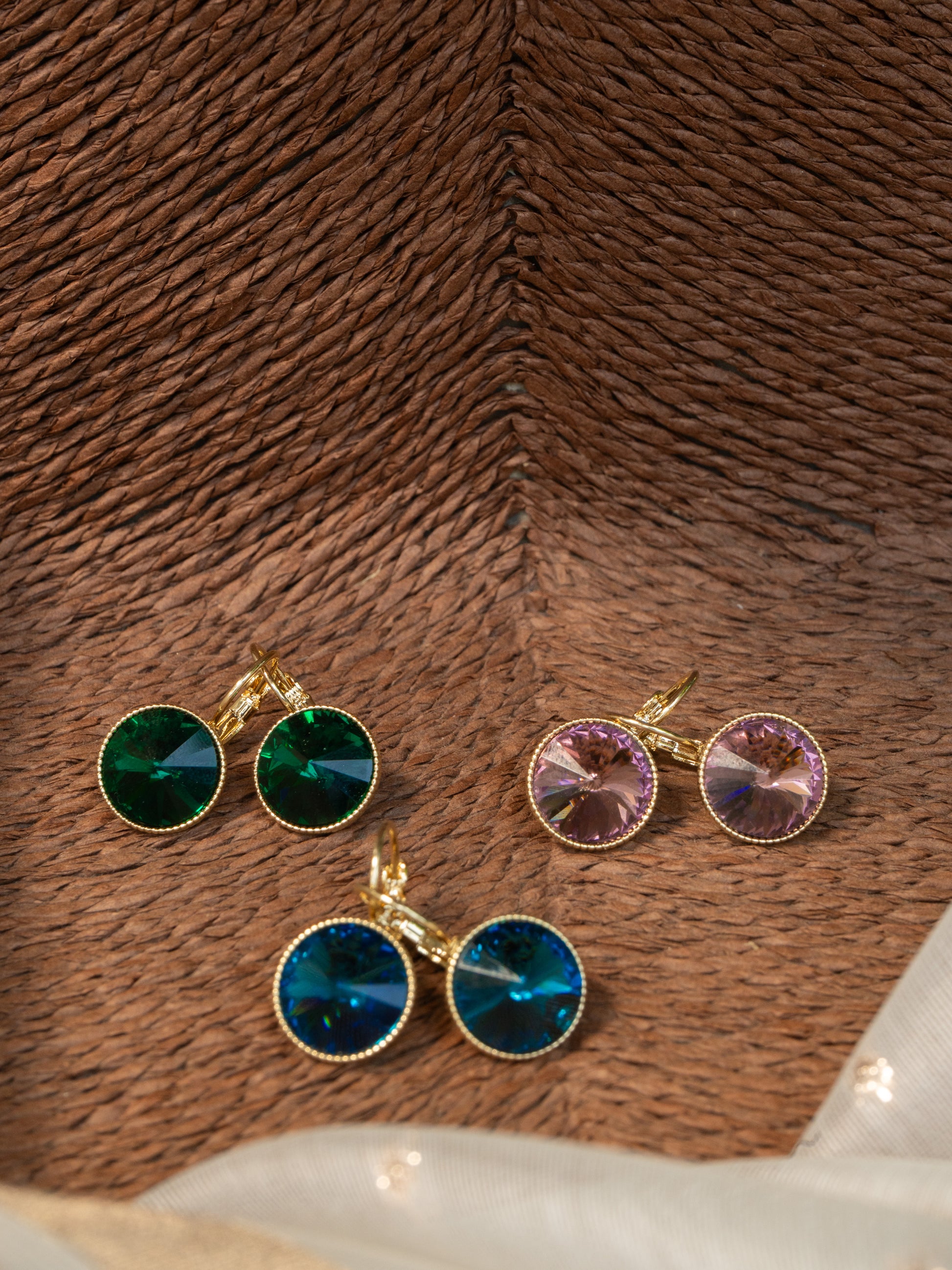 Pastel pink gem earring with gold hook and lock, minimal and elegant drop design.