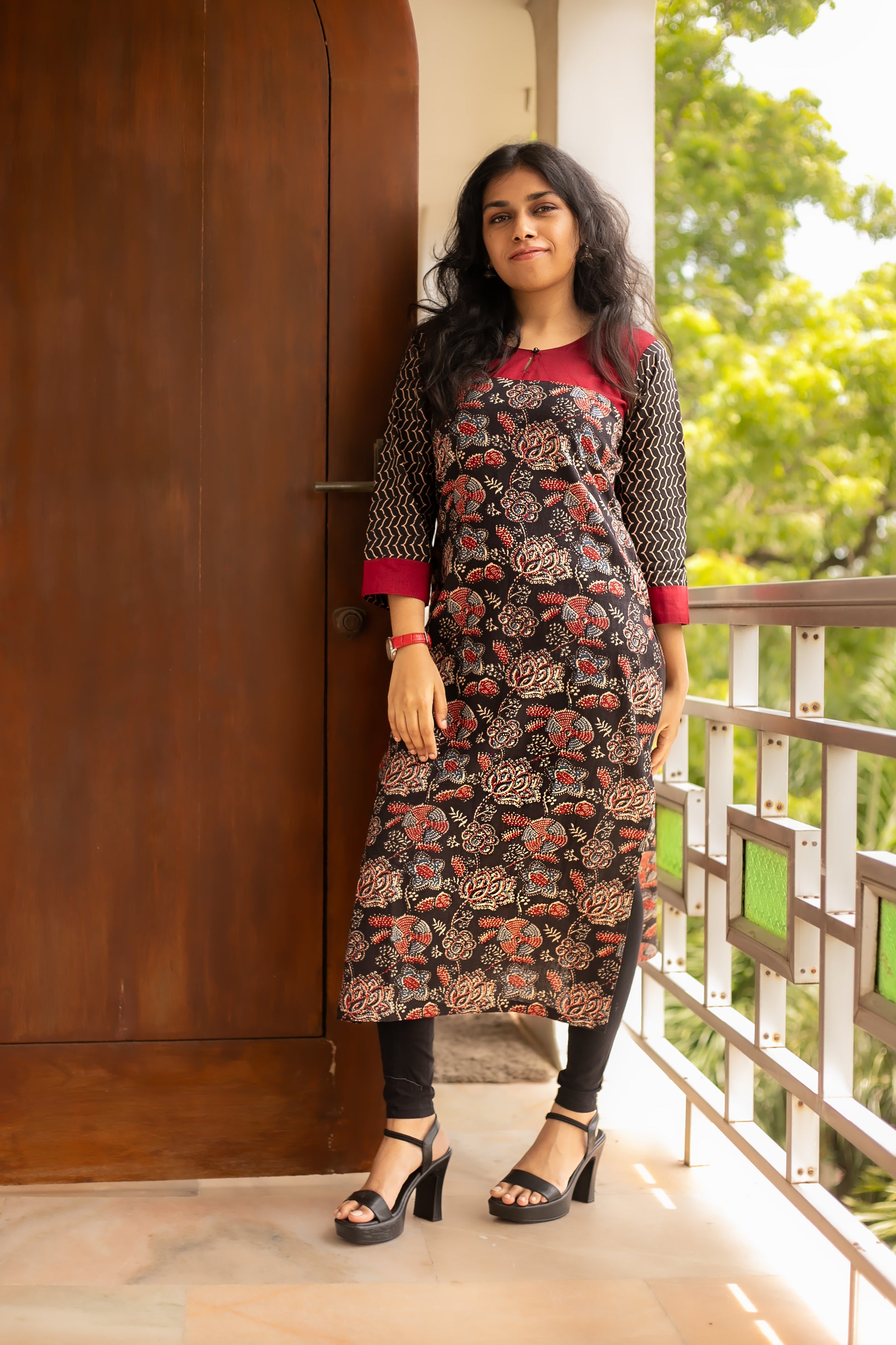 Black Floral Print Cotton designer Kurti, featuring striking contrast red neck and sleeve detailing.