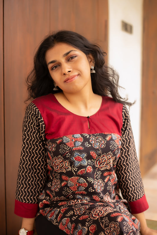 Black Floral Print Cotton designer Kurti, featuring striking contrast red neck and sleeve detailing.