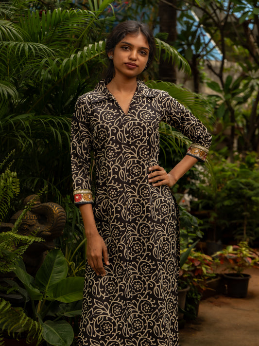 Mid-length view highlighting the shirt collar and floral line-art patterns on black and white cotton kurti, in-house stitched by Sakyaa.