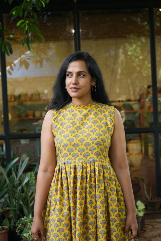 Yellow pleated dress