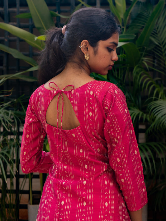 Close-up of triangular back cut with tie detail on bright pink silk cotton kurti from Sakyaa
